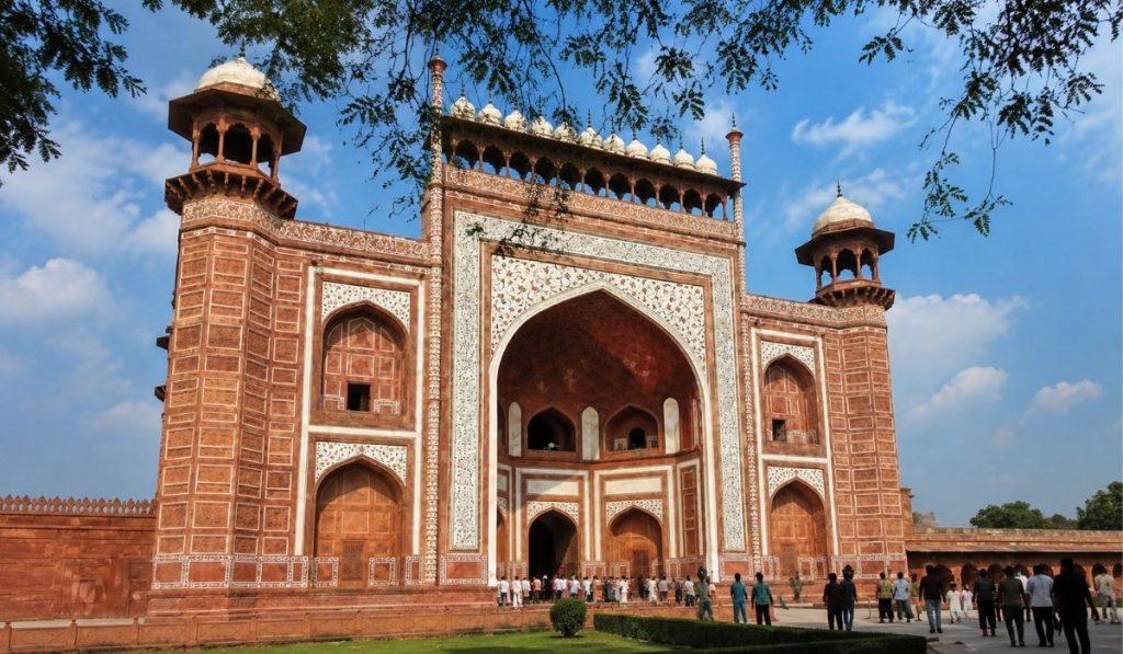 How to Choose a Hotel in Taj Ganj, Agra: 9 Things to Check Before Booking
Taj Ganj has one of the highest concentrations of hotels in Agra, and that's exactly what makes booking here harder than it looks. Every listing claims to be “near the Taj Mahal.” Every photo looks similar on a booking app. And star ratings alone rarely tell you whether a hotel in Taj Ganj Agra actually fits your trip. If you'd rather skip the comparison entirely, you can browse our rooms and tariff directly — otherwise, this guide explains how to choose a hotel in Taj Ganj based on location, Taj Mahal access, reviews, room type, facilities, and overall value.
The cheapest room isn't always the best-value room once you factor in what's actually included, and the highest-rated hotel isn't automatically right for your specific trip. This guide isn't another list of best hotels in Agra or luxury hotels in Agra — it's a checklist for evaluating location, Taj Mahal access, reviews, room type, views, inclusions, and overall value, so you can make the decision yourself.
Why Taj Ganj Is a Popular Place to Stay in Agra
Taj Ganj is one of the most convenient areas to stay when visiting the Taj Mahal, with a large concentration of hotels in Taj Ganj, restaurants, and rooftop cafés close to the monument. It's the default base for most travelers wondering where to stay in Taj Ganj, and for good reason: short travel time to the entrance gates, plenty of food options within walking distance, and accommodation ranging from budget guesthouses to premium view-rooms.
The trade-off is that Taj Ganj's lanes are narrow and busy with foot and auto traffic, and can be noisy in the early morning and evening. That's not a reason to avoid the area — it's a reason to be deliberate about which part of Taj Ganj, and which type of property, you choose.
🏨 Found the Right Hotel — Now Pick Your Room?
🛏️ Check Room Availability
Not sure which room is right for you? Compare Our Hotel Room Types before booking.
Checklist on How to Choose a Hotel in Taj Ganj
1. Check the Hotel's Exact Distance from the Taj Mahal
Don't book a hotel simply because the listing says "near Taj Mahal" — that phrase is used loosely across almost every property in the area. What matters is the actual distance, the walking route, and how long it realistically takes to get from the hotel's front door to the entrance gate.
Two properties can both advertise themselves as nearby while offering very different walking times and routes, so it's worth checking the real distance rather than relying on the label.
Before booking, check:
☐ Straight-line distance vs. actual walking distance
☐ Walking time (lanes here are pedestrian and slower than a map suggests)
☐ Whether the route is direct or requires backtracking
☐ Which entrance gate the hotel is actually closest to
When comparing options, terms like hotels near Taj Mahal, hotel near Taj Mahal Agra, hotels in Taj Ganj near Taj Mahal, hotels walking distance to Taj Mahal, and Taj Mahal nearby hotels will surface most of the relevant listings — just verify the walking time yourself rather than trusting the label.
2. Check Which Taj Mahal Gate Is Convenient
This is an Agra-specific detail most generic hotel guides skip. The Taj Mahal has multiple visitor gates — East Gate and West Gate are the two most commonly used by tourists — and which one is closer to your hotel affects your entry time, your queue, and your walking route.
If you're planning a sunrise visit, gate proximity matters even more, since you'll want to minimize the time between leaving your room and reaching the ticket line. Ask your hotel directly which gate they recommend and how long it takes to walk there at that hour.
A hotel near Taj Mahal East Gate or hotel near Taj Mahal West Gate — whichever suits your entry point and arrival route — is worth confirming directly with the property. Look for genuine hotels near Taj Mahal entrance access rather than a vague hotel near Taj Mahal gate claim.
3. Choose Your Hotel Category Based on Your Trip
Not every traveler needs the same thing from a hotel in Taj Ganj. Start with the type of trip you're taking. A budget-conscious solo traveler may care most about price, cleanliness, and location, while a family may need more space and flexible breakfast options. Couples may prioritize privacy and room quality, and honeymooners may be willing to pay more for a premium room or a genuine Taj Mahal view.
TravelerPriorityBudget travelerPrice + cleanliness + locationSolo travelerConvenience + safety + priceCoupleComfort + privacy + locationFamilySpace + breakfast + facilitiesHoneymoonPremium room + view + privacyLuxury travelerService + facilities + room experienceBusiness travelerWi-Fi + workspace + accessibility
Depending on which of these fits you, it's worth browsing budget hotels in Taj Ganj, 3 star hotels in Taj Ganj, family hotels in Taj Ganj, hotels for couples in Taj Ganj, or honeymoon hotels in Agra as a starting shortlist. If premium service and facilities matter more to you than price, compare against our luxury hotels near the Taj Mahal guide instead — the same page covers luxury hotels in Taj Ganj more broadly. Travelers watching cost closely should look for genuinely affordable hotels near Taj Mahal rather than the best hotel for budget by name alone, since pricing varies by season.
4. Read Recent Hotel Reviews Before Booking — and Know What to Look For
Reading hotel reviews is common advice. Knowing how to interpret them is one of the most useful hotel booking tips there is.
Look for repeated complaints, not isolated ones. Scan for recurring mentions of hotel cleanliness, bathroom condition, AC performance, room maintenance, street noise, staff responsiveness, breakfast quality, Wi-Fi reliability, and check-in experience — these cover most of the hotel facilities points worth checking.
Prioritize recent reviews. A hotel's condition and service level can shift over months — a review from two years ago tells you less than one from the past few weeks.
Look for patterns, not single data points. One guest complaining about a stained sheet doesn't mean a hotel is poorly maintained. Twenty recent guests mentioning the same issue is a real signal worth taking seriously. This kind of pattern-reading is really what how to choose a good hotel comes down to, and it covers most of the general things to check before booking a hotel.
5. Check What "Taj Mahal View" Actually Means
This phrase gets used more loosely than almost any other in Taj Ganj hotel marketing. There's a real difference between:
A Taj Mahal view room with the view from inside the room
A Taj Mahal view hotel offering the view from a shared rooftop terrace
A partial or limited view (a corner, a glimpse between buildings)
Before booking a hotel with Taj Mahal view, verify the room category, the floor, whether there's a balcony, whether the view is direct or partial, and whether that specific view is guaranteed for your room type or just possible depending on availability. When comparing Taj Mahal view hotels in Taj Ganj, this detail matters more than the star rating — it's what actually determines whether you've booked the best Taj Mahal view hotel for your trip or just paid extra for a rooftop glimpse.
6. Compare the Room, Not Just the Hotel
Two hotels can carry near-identical overall ratings and still offer very different room experiences. Before booking, check room size, bed type, bathroom condition, AC, Wi-Fi reliability, seating space, natural light, view, and whether an extra bed is available if needed — the fundamentals across all hotel room types.
A deluxe room is often enough for a short sightseeing trip. A suite room tends to make more sense for families, longer stays, or travelers who simply want more space. You can compare current room types and rates directly on our rooms and tariff page, which is also the best place to check the best room near Taj Mahal for your group size.
7. Check What Is Included in the Price
Don't compare ₹2,500 against ₹3,500 as if they're the same product with a different price tag. Check what's actually bundled into each hotel price in Taj Ganj: breakfast, Wi-Fi, AC, taxes, parking, extra-bed charges, laundry, cancellation terms, airport/station transfers, and restaurant access.
The cheapest room on paper isn't always the cheapest stay once these extras are added back in — this is where real hotel value for money is decided, not on the headline rate.
8. Consider How Much Time You'll Actually Spend at the Hotel
This changes what you should prioritize:
Mostly sightseeing? Prioritize location, cleanliness, and price — you'll barely be in the room.
Spending real time at the hotel? Prioritize room quality, hotel facilities, restaurant, view, and comfort.
Visiting at sunrise? Prioritize location, gate access, and how easy it is to leave the property early in the morning — a five-minute lobby delay can matter at 5 a.m.
9. Compare Value, Not Just Price
The Hotel Value Formula
Location + Room + Cleanliness + Reviews + Facilities + Price = Overall Value
A ₹2,500 room isn't automatically better value than a ₹3,500 one, and a ₹7,000 room isn't automatically worth the premium either. The useful question is always: what am I getting for the additional money? — more space, a real view, better location, or just a nicer lobby.
Which and How to Choose a Hotel in Taj Ganj? A Quick Decision Table
If you are...Prioritize...Visiting for 1 nightLocation + priceVisiting Taj Mahal at sunriseTaj Mahal accessA coupleComfort + privacyA familyRoom size + facilitiesOn honeymoonPremium room + viewBudget-consciousValue + locationStaying 3+ nightsRoom + comfortA light sleeperQuiet locationDriving to AgraParking + road accessSet on Taj Mahal viewsActual in-room view
Taj Ganj Hotel Booking Checklist
How far is the hotel from the Taj Mahal — actually, not just on paper?
How long does it take to walk there?
Which Taj Mahal gate is convenient from this hotel?
What do recent reviews say, and do complaints repeat?
Are the rooms clean and well maintained based on current feedback?
Is the room large enough for your group?
If a Taj Mahal view is advertised, is it actually from the room?
What is included in the quoted price?
Are there likely extra charges (parking, extra bed, taxes)?
Does the hotel actually fit your travel plans — sightseeing pace, sunrise visit, length of stay?
Example: How to Evaluate Hotel Sun Grand
Here's how the same checklist plays out when evaluating a property like Hotel Sun Grand.
1. Location — Hotel Sun Grand is positioned within Taj Ganj, close to the Taj Mahal — worth confirming the exact walking distance and nearest gate directly with the hotel for your specific dates.
2. Room selection — The property offers a range of categories, including Deluxe, Super Deluxe, Taj View Suite, and Maharaja Suite rooms, suited to different traveler types — see current availability on the rooms and tariff page.
3. View — Travelers specifically wanting a Taj Mahal view should confirm which room category includes it and whether it's guaranteed for that category or a rooftop-only option.
4. Facilities — Worth checking current amenities and whether rooftop or restaurant dining is available, particularly if you plan to spend more downtime at the property.
5. Price/value — Whether the rate represents good value depends on what's included — apply the value formula above before comparing it to other options.
Whether Hotel Sun Grand is the right choice ultimately depends on your budget, travel group, preferred room category, and how much weight you place on proximity and views. For a broader comparison across the city, our guide to the best hotels in Agra applies the same evaluation approach citywide, while the luxury hotels near the Taj Mahal guide is the better starting point if premium service is your priority.
FAQ - How to Choose a Hotel in Taj Ganj
What should I look for when choosing a hotel in Taj Ganj?
Check actual distance and walking time to the Taj Mahal (not just the listing claim), which gate is closest, recent review patterns, what's included in the price, and whether the room type matches your trip.
What is the best location to stay in Taj Ganj?
The area closest to your preferred entrance gate — East or West — with a short, direct walking route tends to work best, especially if you're planning an early visit.
Is it better to stay within walking distance of the Taj Mahal?
For most first-time visitors, yes — it saves transport time and makes sunrise or early-morning visits far easier. If you're driving or touring other parts of Agra as well, location matters slightly less.
Is Taj Ganj a good area to stay in Agra?
Yes, for most first-time visitors — it offers the shortest travel time to the Taj Mahal and a dense cluster of restaurants and hotel options, though lanes can be narrow and busy.
Does a Taj Mahal view room actually matter?
It depends on the traveler. If a view matters to you, verify it's a direct in-room view rather than a shared rooftop or partial view before paying the premium.
Is the cheapest hotel room in Taj Ganj the best deal?
Not necessarily. Compare what's included — breakfast, Wi-Fi, taxes, parking — since a slightly higher rate with more inclusions can work out cheaper overall.